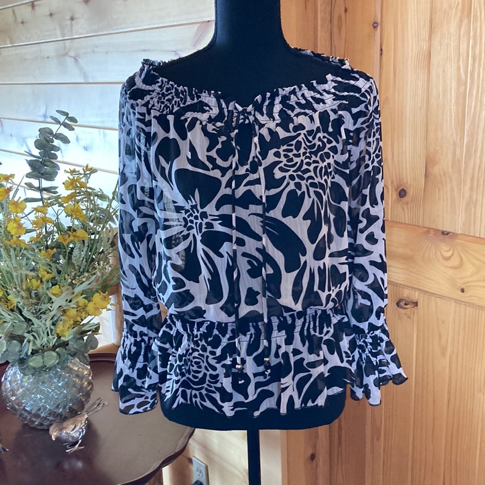Black and white sheer peplum blouse